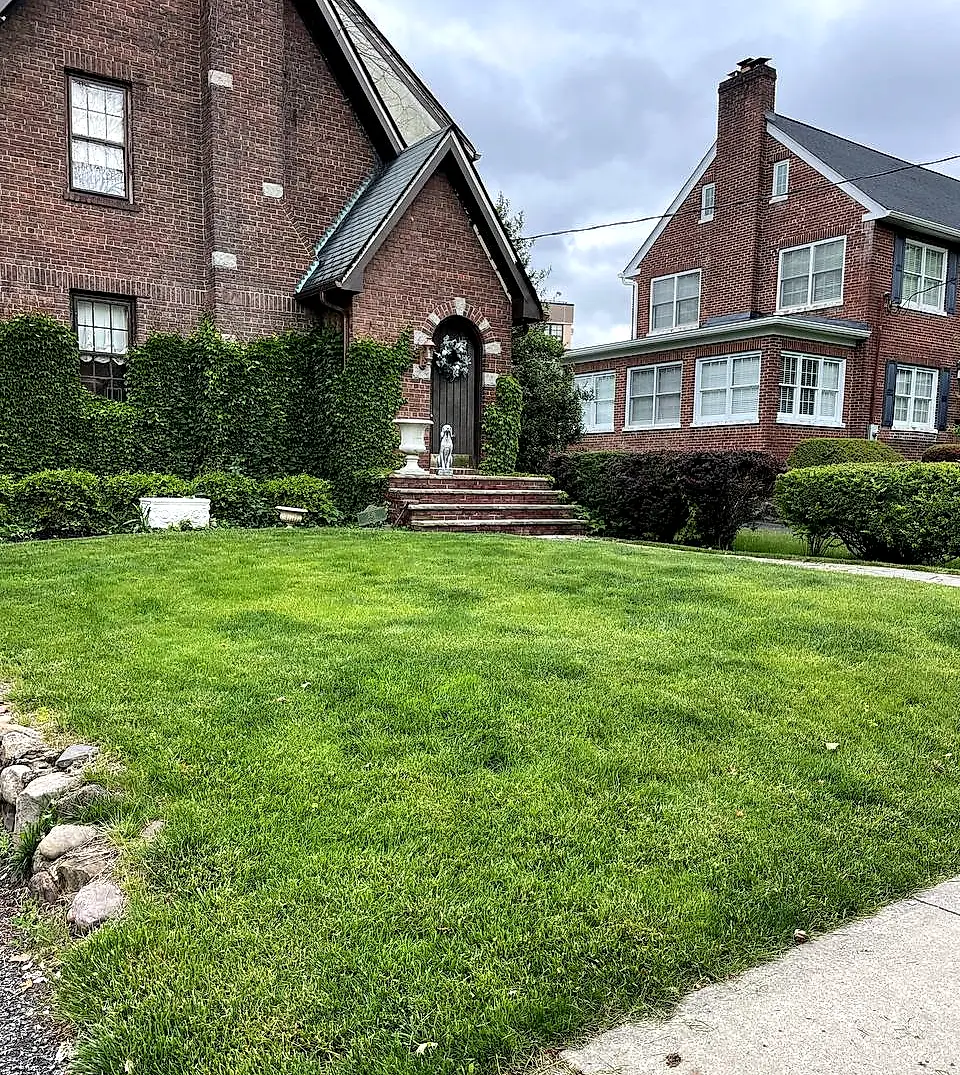 Renewed front lawn at a brick residence